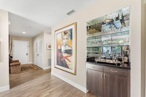 a view of a dining room with furniture large windows and wooden floor
