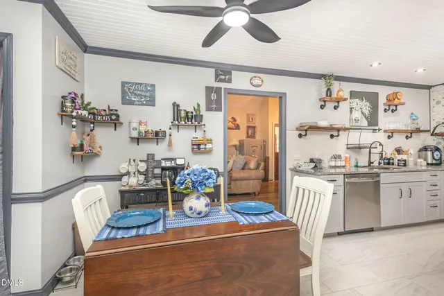 a living room with fireplace furniture and a flat screen tv