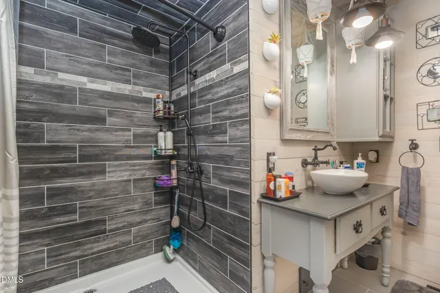 a kitchen with sink and refrigerator