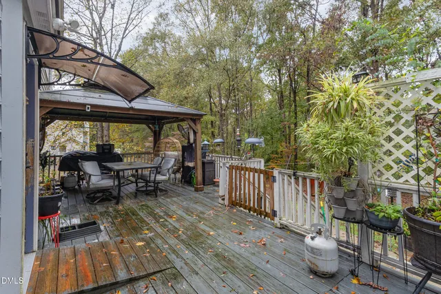 a view of balcony with chairs and wooden floor