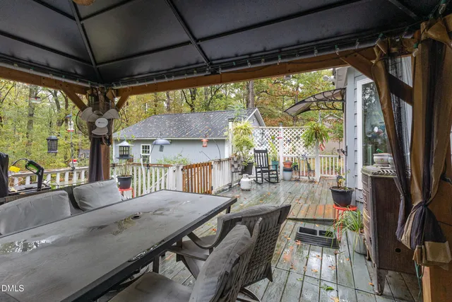 a view of a chairs and table in the patio