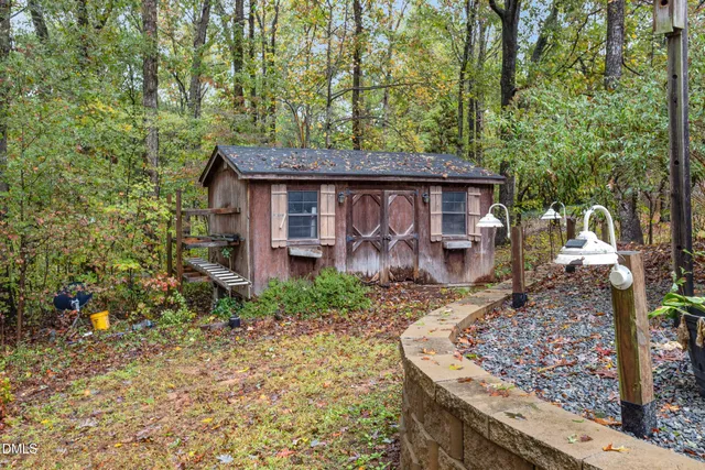 a dining room with furniture and a floor to ceiling window