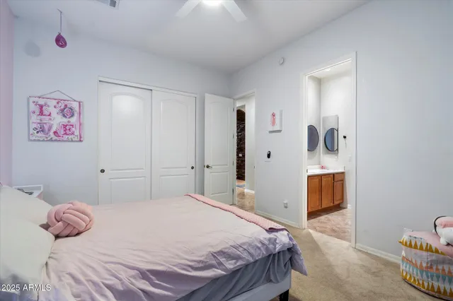 a bedroom with a bed and lamps