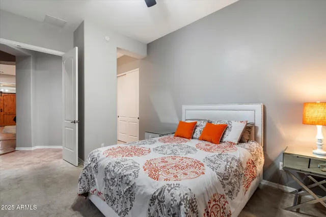 a bathroom with a granite countertop sink mirror and a bathtub