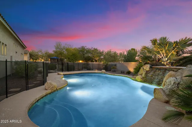 a view of a swimming pool with an outdoor space and seating area