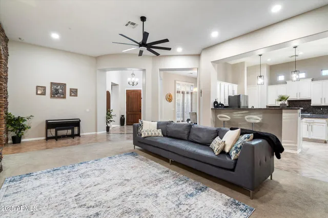 a kitchen with a refrigerator and a stove top oven