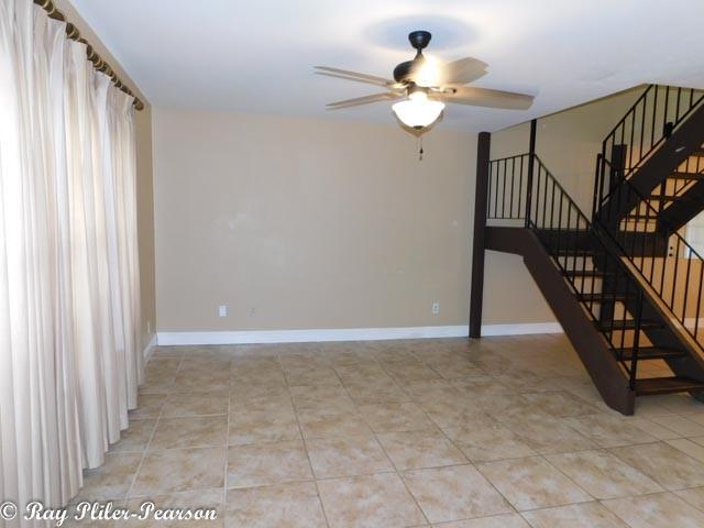 8020 Pines Road Shreveport, LA 71129 - Photo 2 of 24 Living area with ceramic tile flooring and windows for natural light.