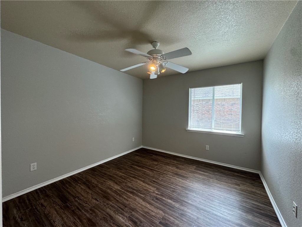 921 Whitewing Lane College Station, TX 77845 - Photo 13 of 14 an empty room with a window and a fan
