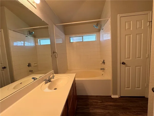 a bathroom with a sink and shower