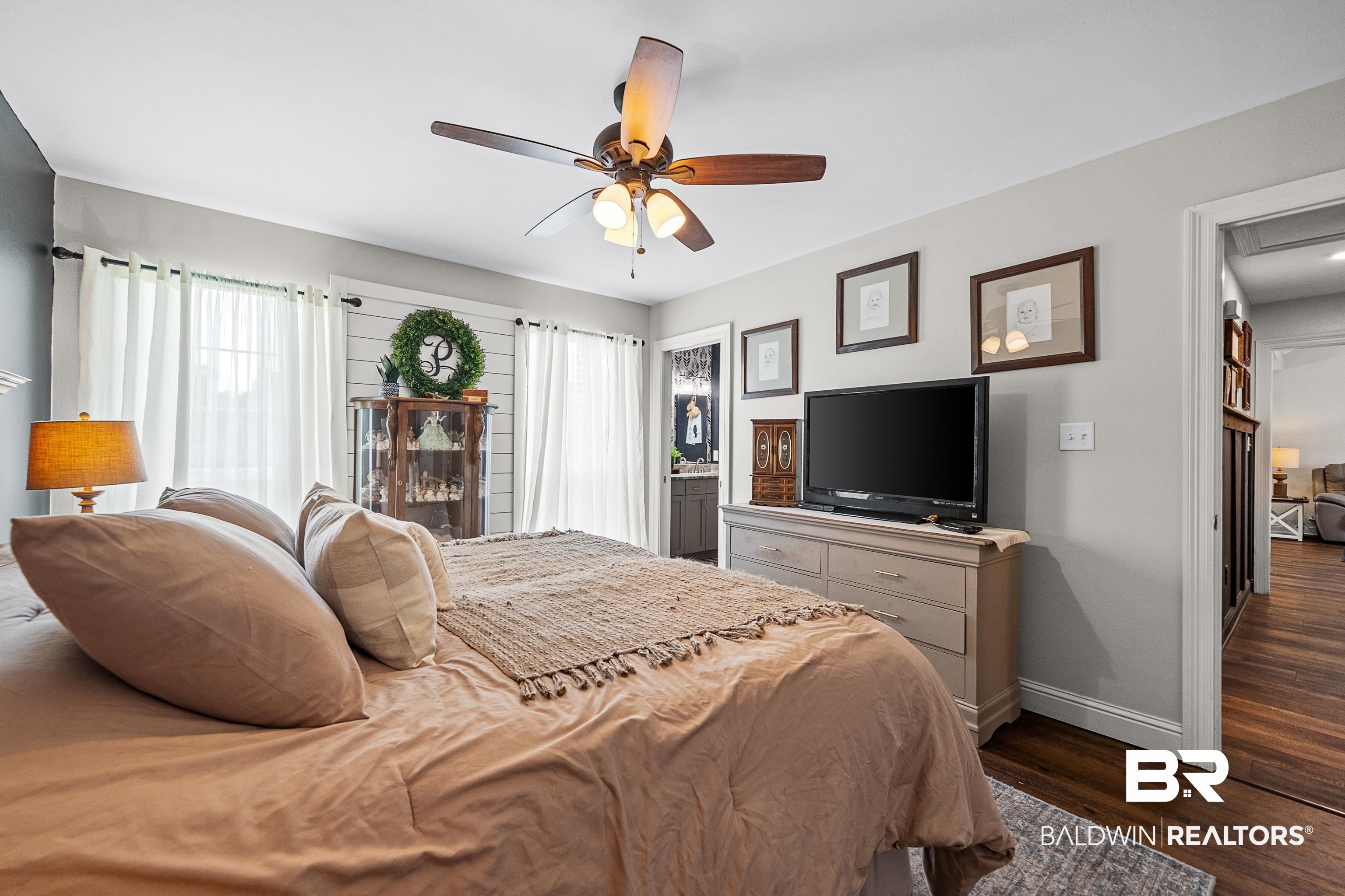 25212 Reeves Lane Elberta, AL 36530 - Photo 16 of 28 Bedroom featuring dark wood finished floors and a ceiling fan
