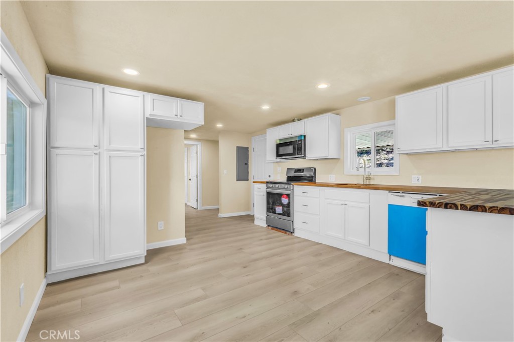 15905 Kugelman Street Lower Lake, CA 95457 - Photo 34 of 75 a kitchen with stainless steel appliances granite countertop a refrigerator sink and cabinets