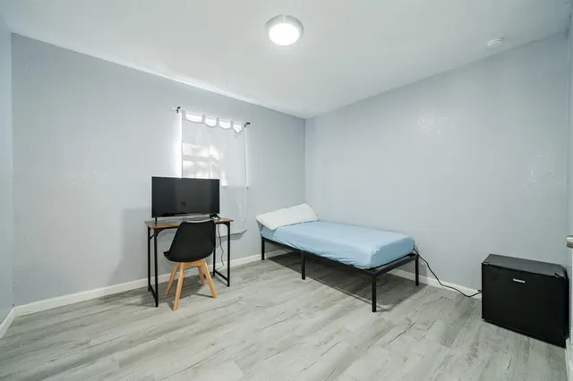 a room with furniture and a wooden floor