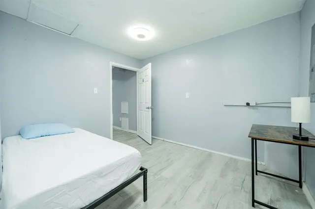 a bedroom with a bed and a table in it