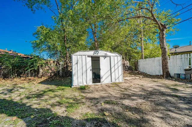 a house with trees in front of it
