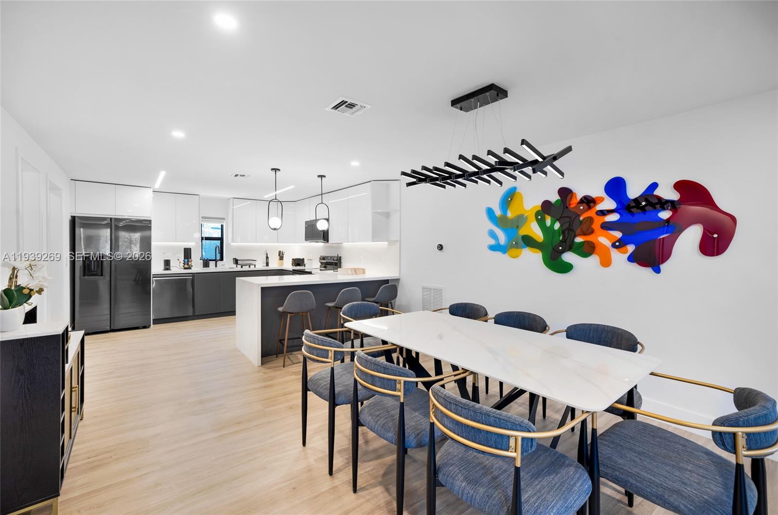 111 Northwest 53rd Street Miami, FL 33127 - Photo 18 of 53 a view of a dining room kitchen and furniture