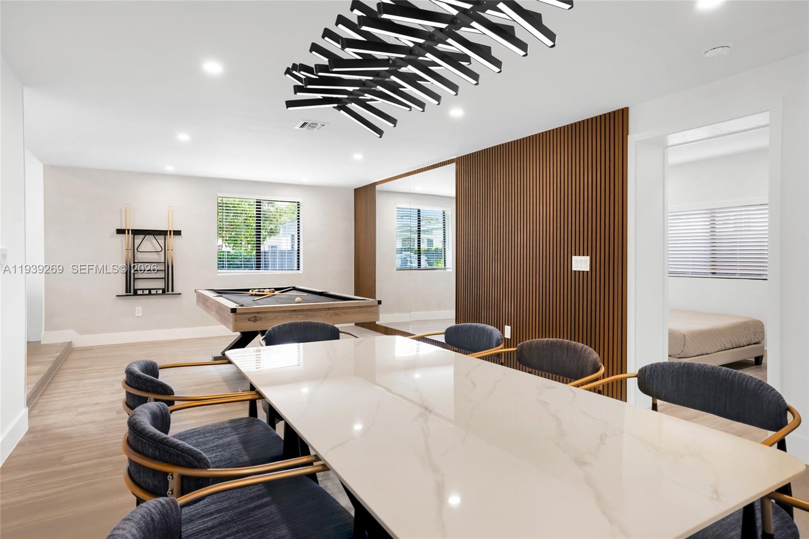 111 Northwest 53rd Street Miami, FL 33127 - Photo 19 of 53 a living room with furniture and a large window