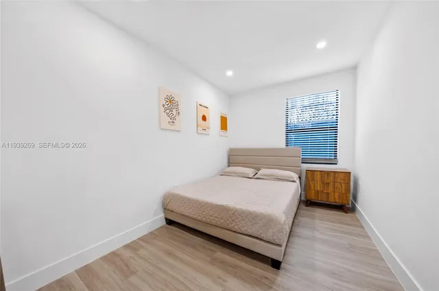 a room with a bed and a window