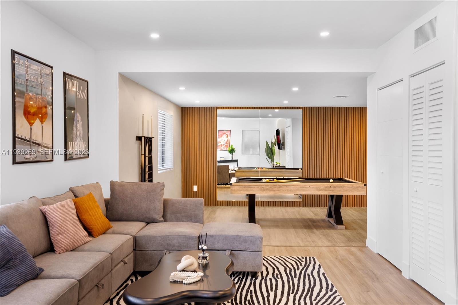 111 Northwest 53rd Street Miami, FL 33127 - Photo 3 of 53 a living room with furniture and a table