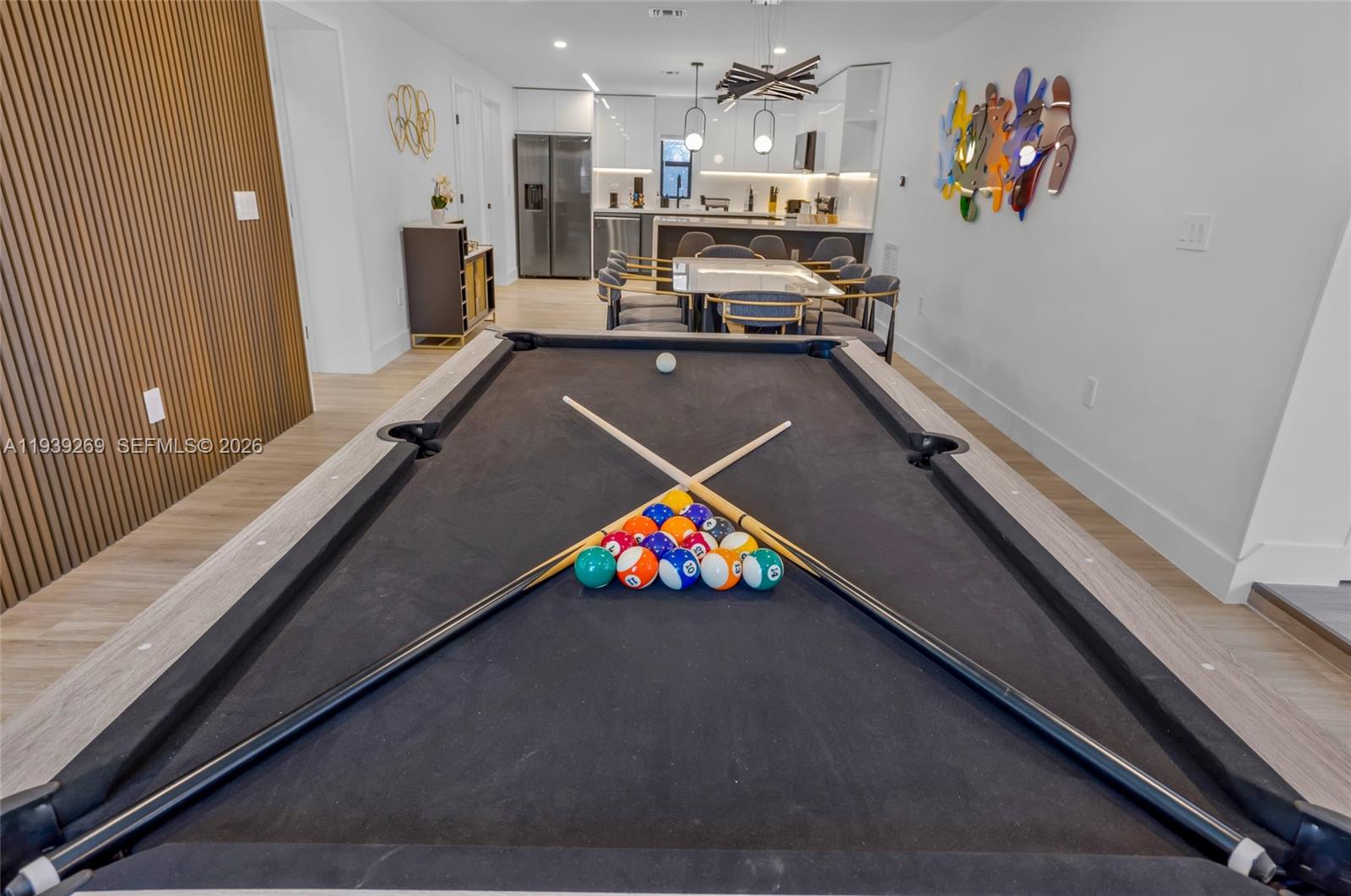 111 Northwest 53rd Street Miami, FL 33127 - Photo 35 of 53 a living room with furniture and a flat screen tv