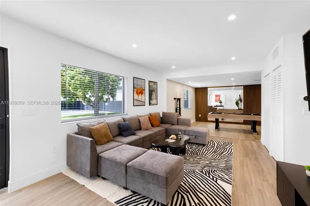 a living room with furniture and a window