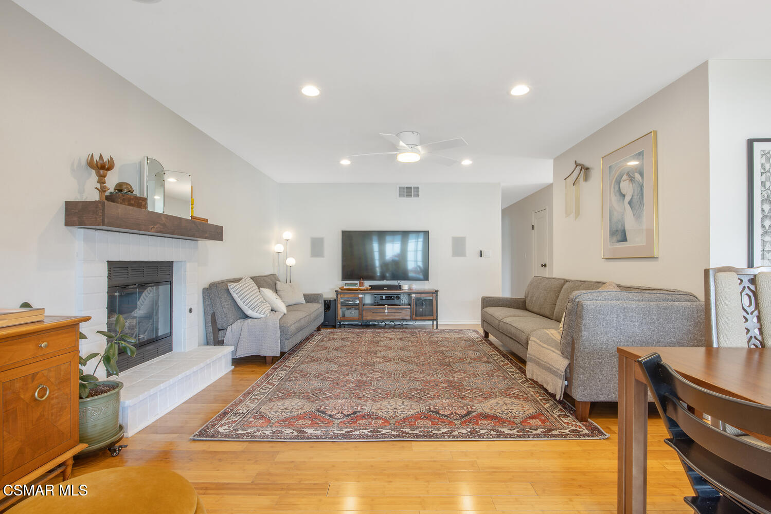 6657 Quartz Avenue Winnetka, CA 91306 - Photo 12 of 26 a living room with furniture and a fireplace