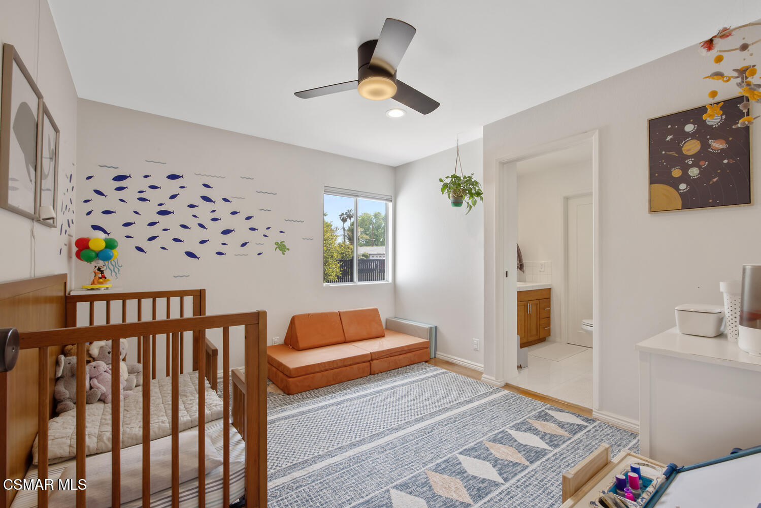 6657 Quartz Avenue Winnetka, CA 91306 - Photo 17 of 26 a bedroom with furniture and wooden floor