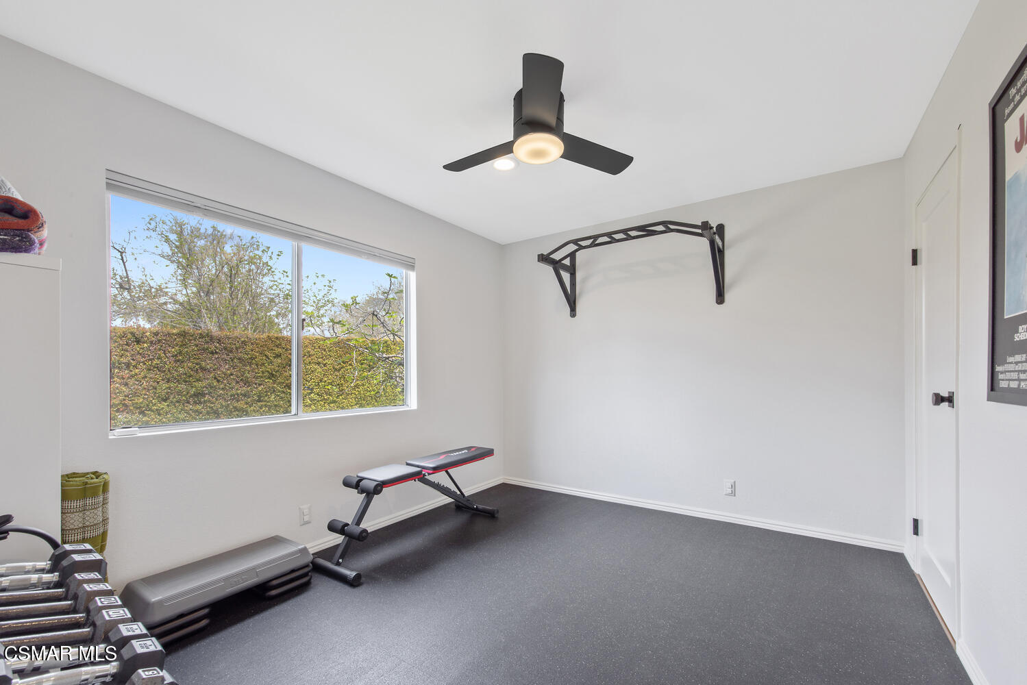 6657 Quartz Avenue Winnetka, CA 91306 - Photo 19 of 26 a room with gym equipment and a window