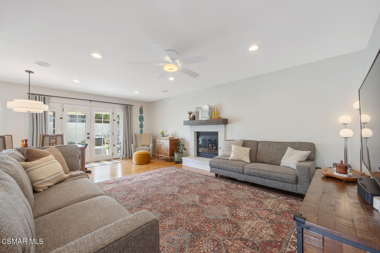 6657 Quartz Avenue Winnetka, CA 91306 - Photo 2 of 26 a living room with furniture and a fireplace