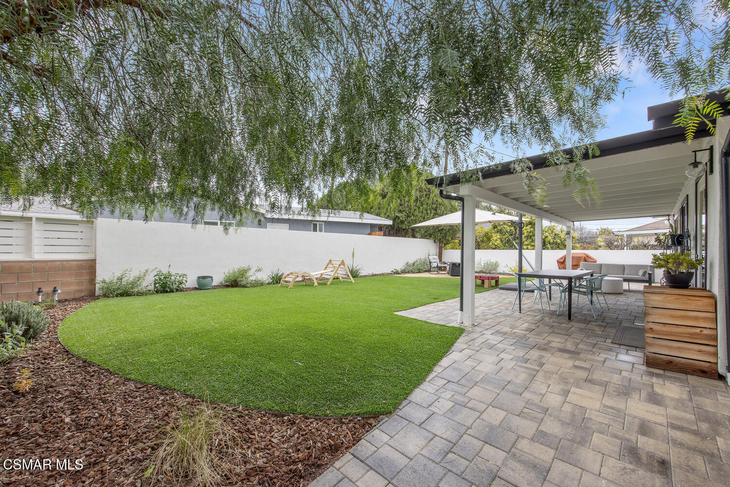 6657 Quartz Avenue Winnetka, CA 91306 - Photo 21 of 26 a view of backyard with outdoor seating and green space