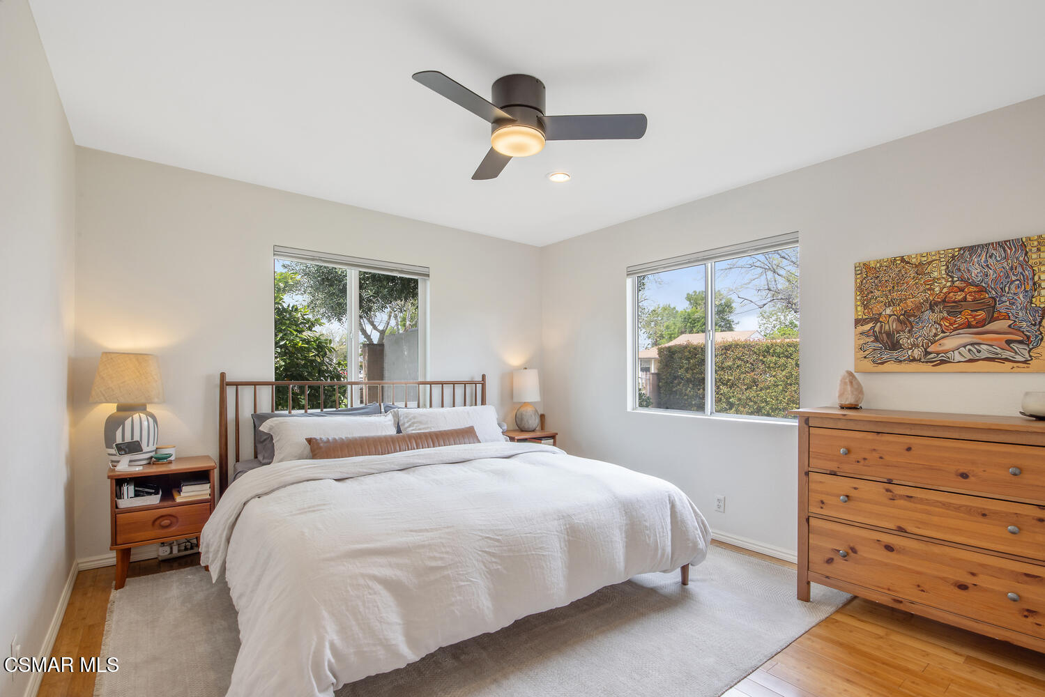 6657 Quartz Avenue Winnetka, CA 91306 - Photo 4 of 26 a bedroom with a large bed and a window