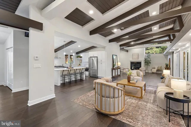 a hallway with a bench and a fireplace