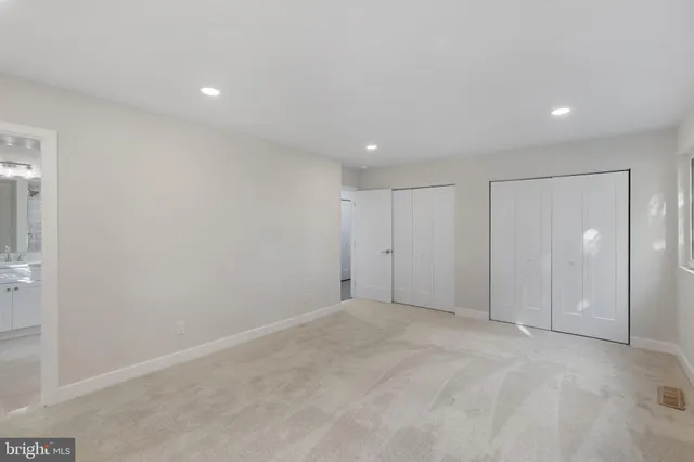 a bathroom with a sink double vanity and a mirror