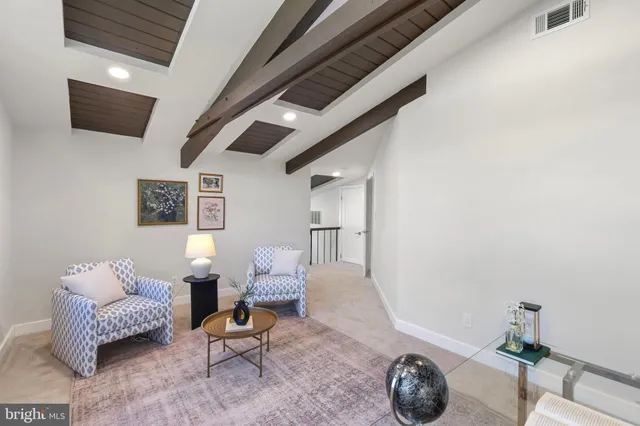 a bedroom with a bed and a lamp