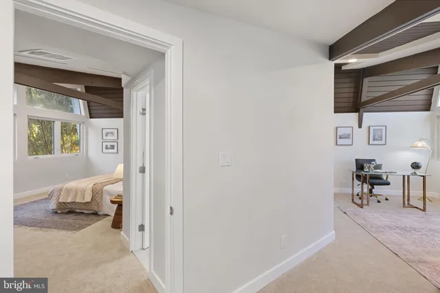 a bathroom with a double vanity sink mirror and toilet