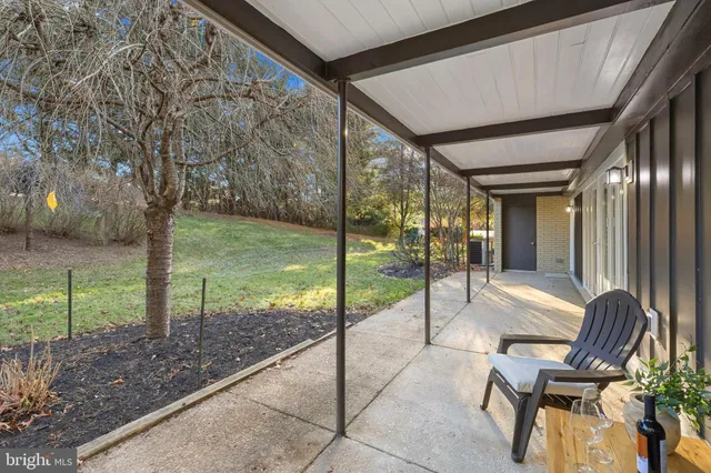 an aerial view of a house with a swimming pool