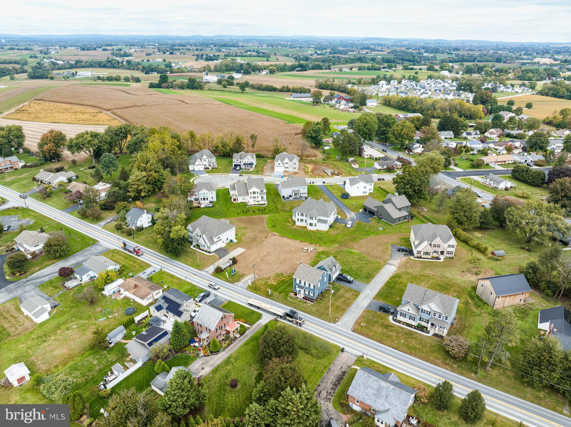 350 Village Road, Unit HAWTHORNE Strasburg, PA 17579 - Photo 42 of 45 an aerial view of residential houses with outdoor space