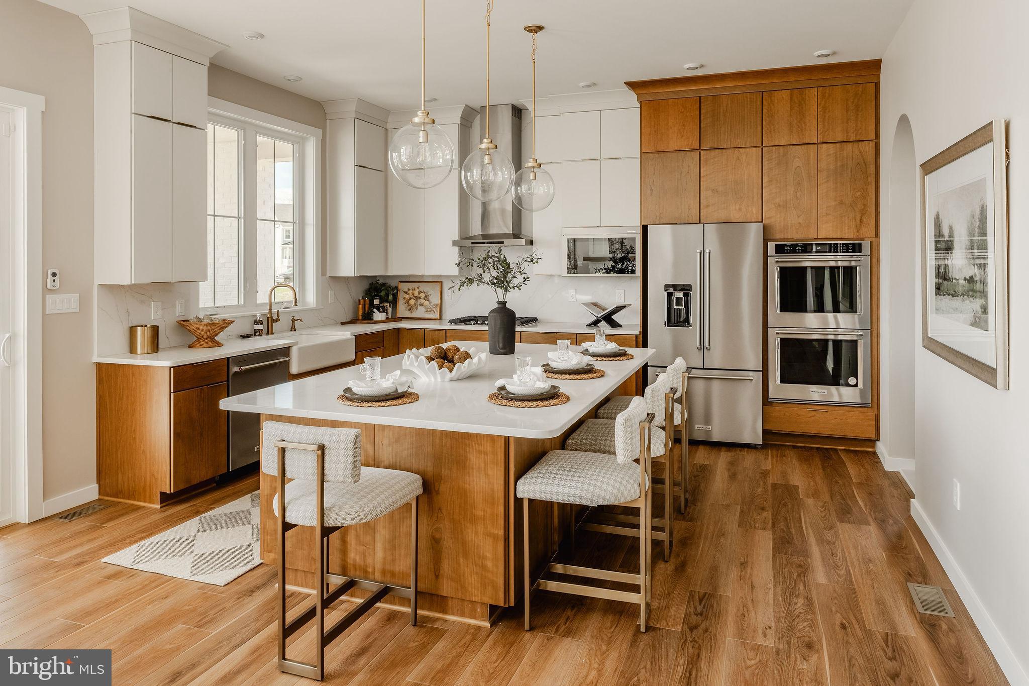 350 Village Road, Unit HAWTHORNE Strasburg, PA 17579 - Photo 9 of 45 a view of a dining room with furniture window and wooden floor
