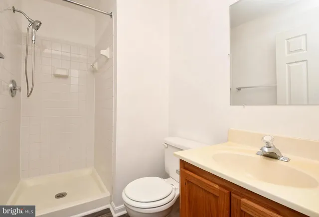 a view of a house with wooden fence