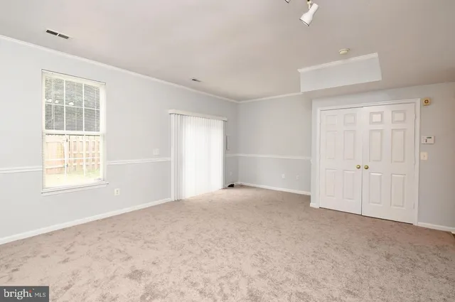 an empty room with windows