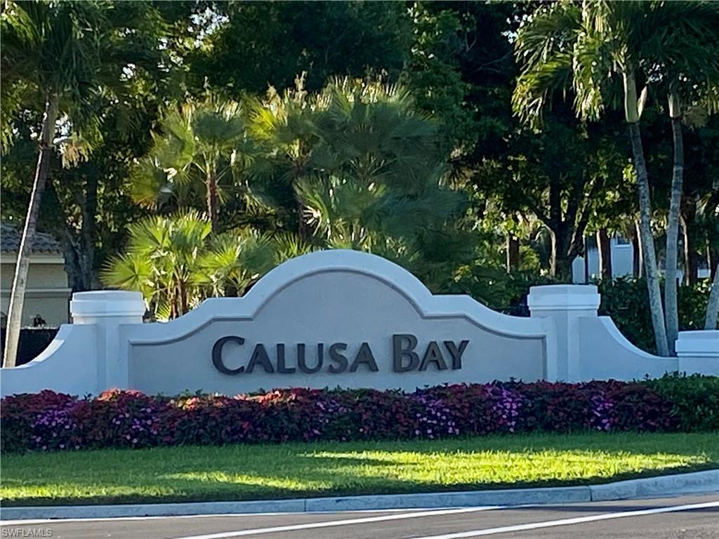 6914 Satinleaf Road North, Unit 102 Naples, FL 34109 - Photo 1 of 24 View of community / neighborhood sign