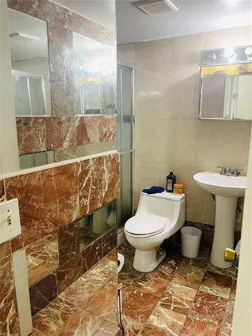 a bathroom with a toilet and a sink