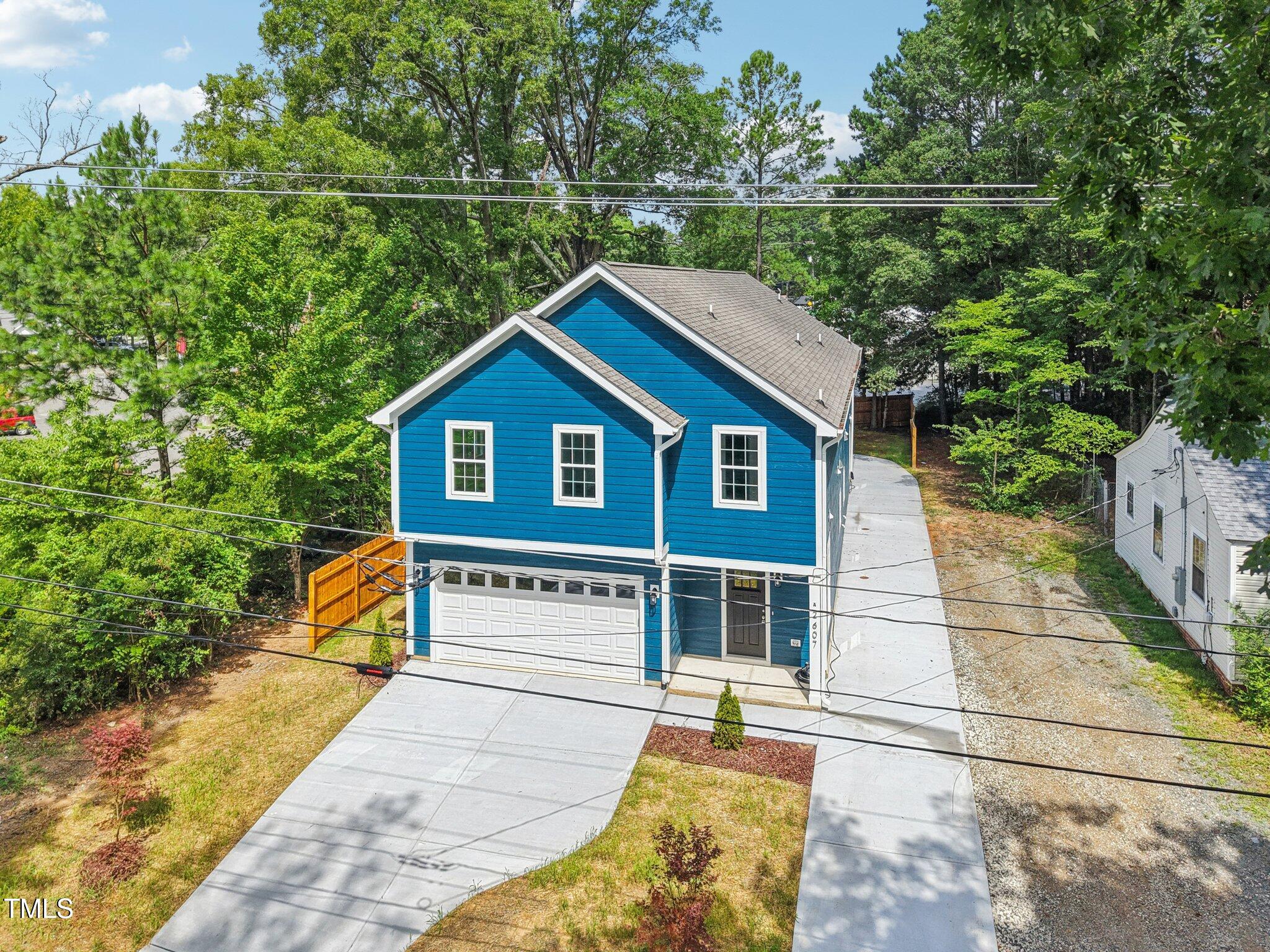 2607 Duke Homestead Road, Unit A Durham, NC 27705 - Photo 25 of 27 a view of house with backyard