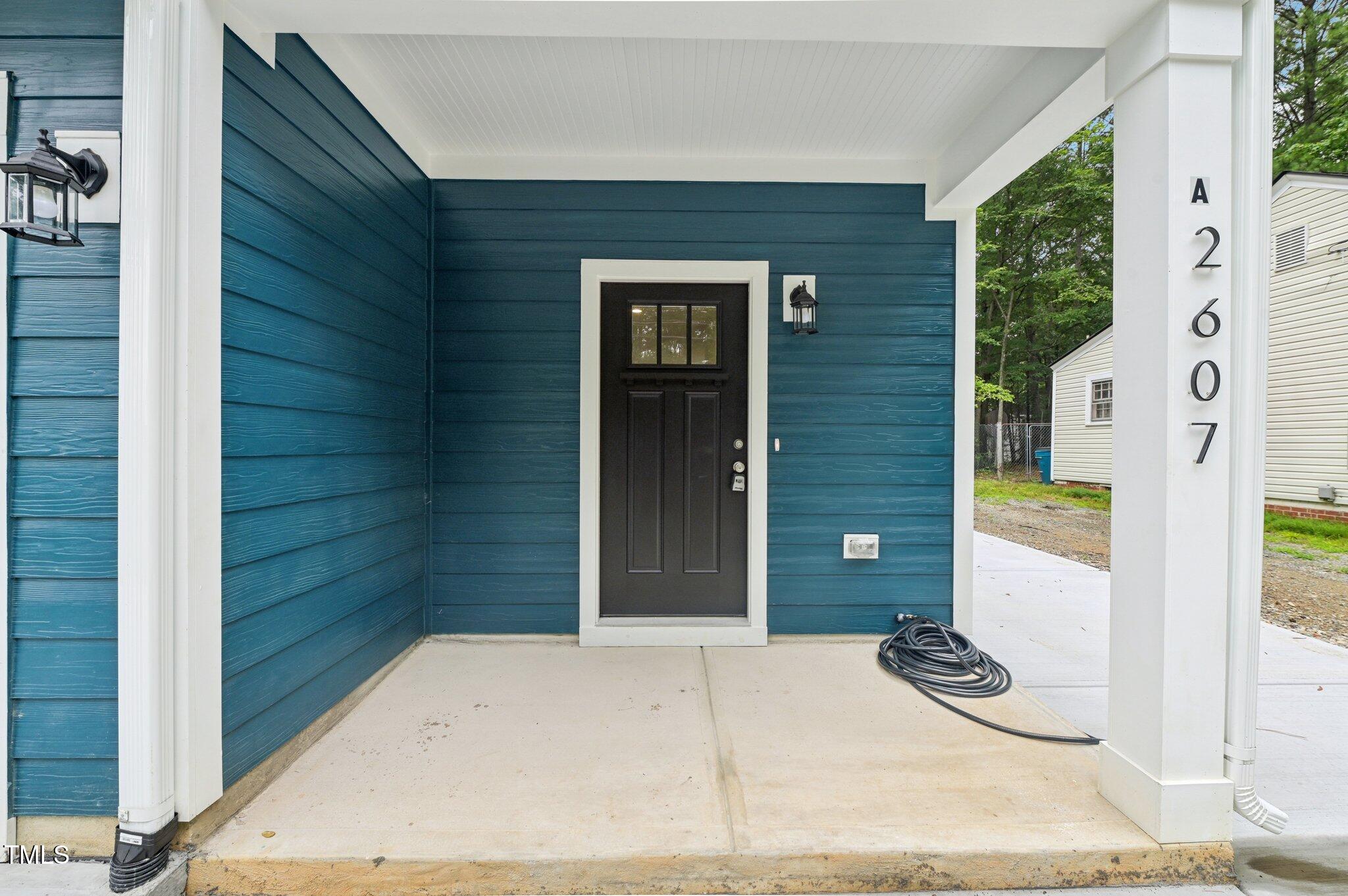 2607 Duke Homestead Road, Unit A Durham, NC 27705 - Photo 4 of 27 a door view with a outdoor space