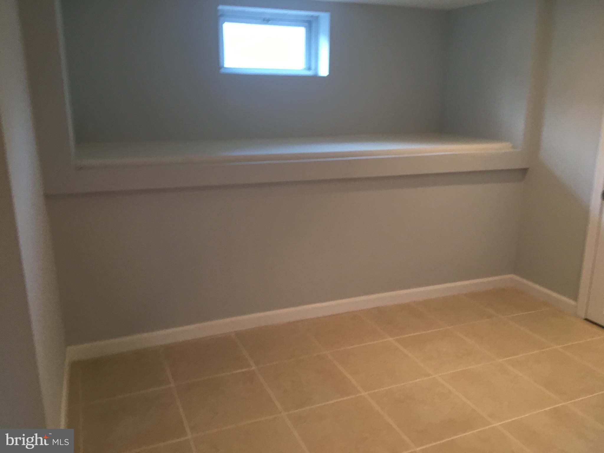 8460 Rugby Road Pasadena, MD 21122 - Photo 20 of 29 Laundry/storage area
