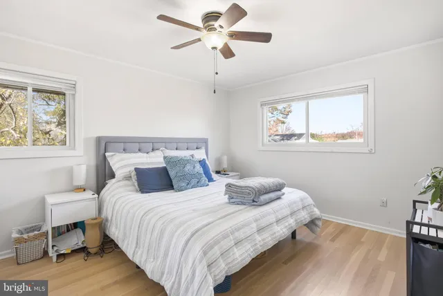 a bedroom with bed and a window