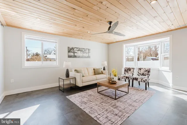 a living room with furniture and a rug