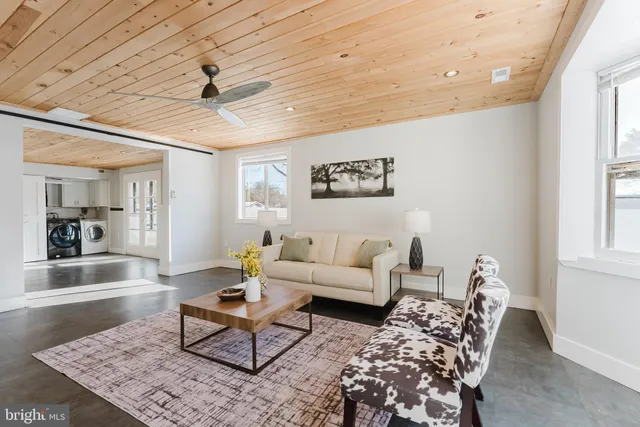 a living room with furniture and a rug