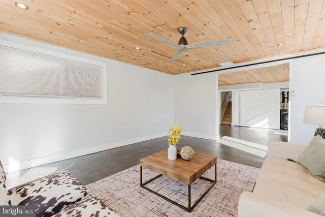 a view of a storage & utility room with refrigerator and dishwasher