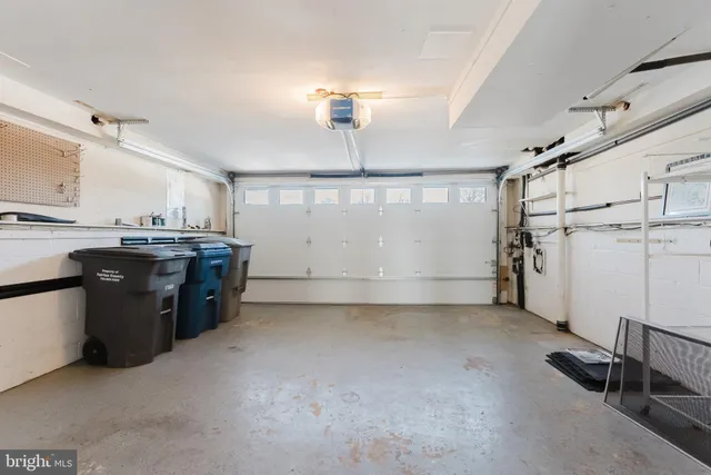 a view of a room with cabinet a flat screen tv and windows