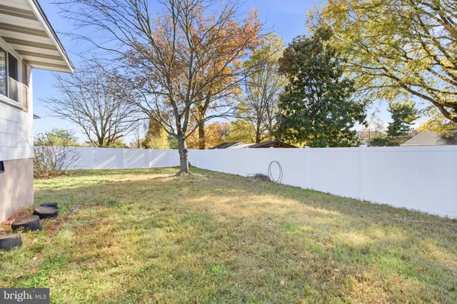a front view of house with yard and seating area